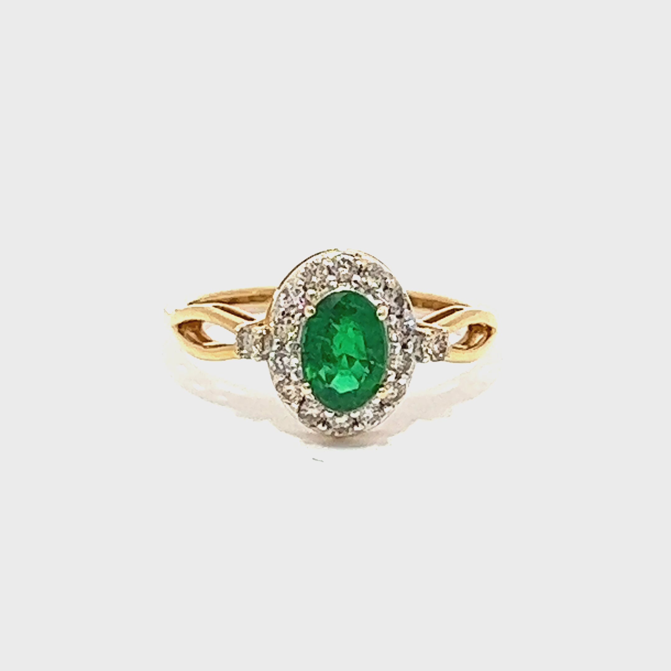 Oval Emerald Diamond Halo Ring